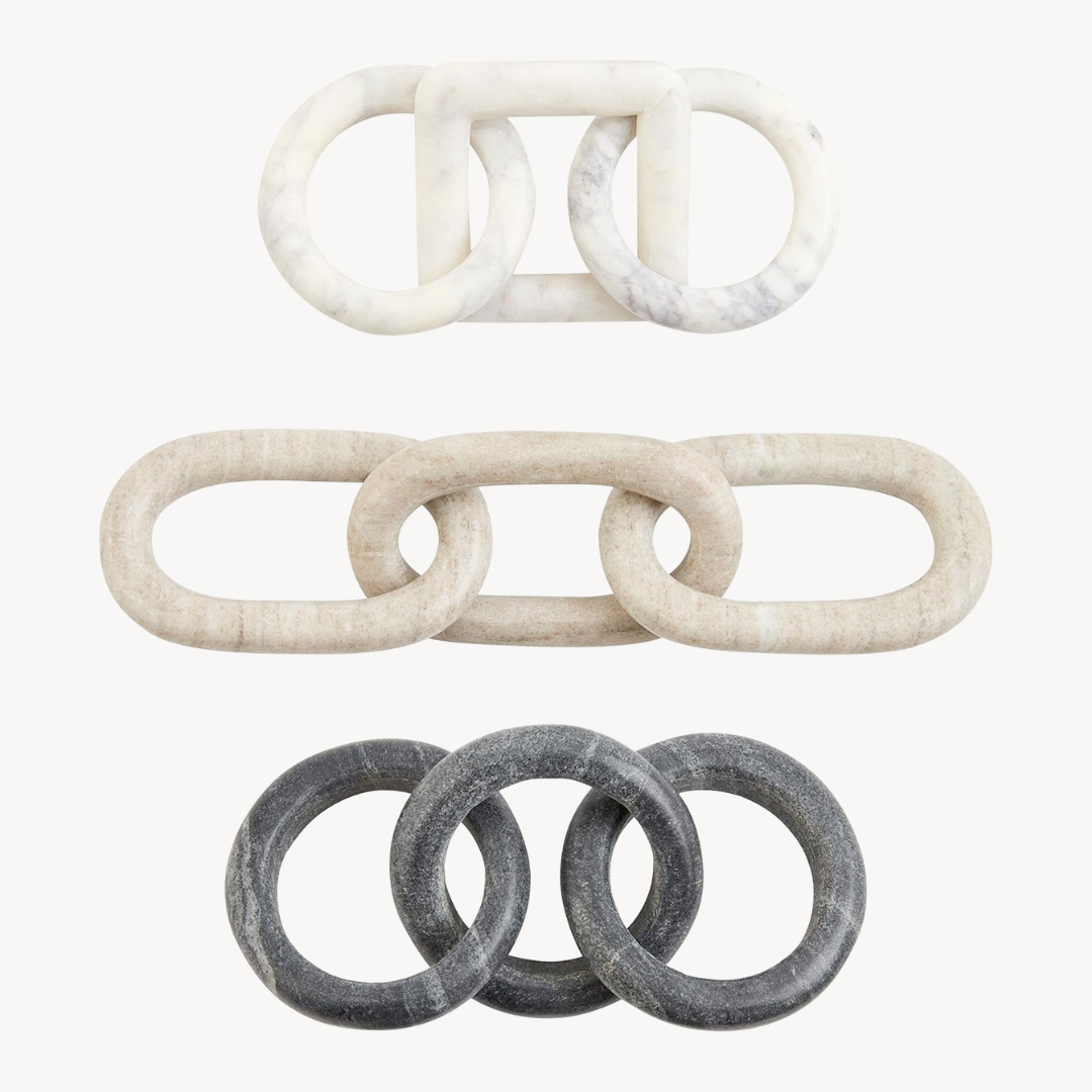 Three sets of marble decor links in different shades of gray and white, arranged in overlapping circular shapes