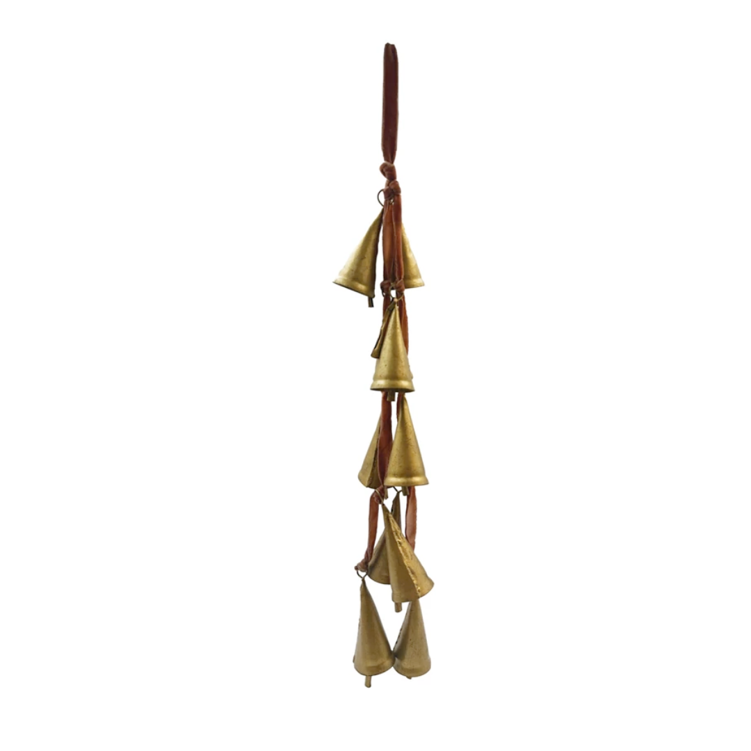 Decorative hanging bells with a brown velvet ribbon on a white background