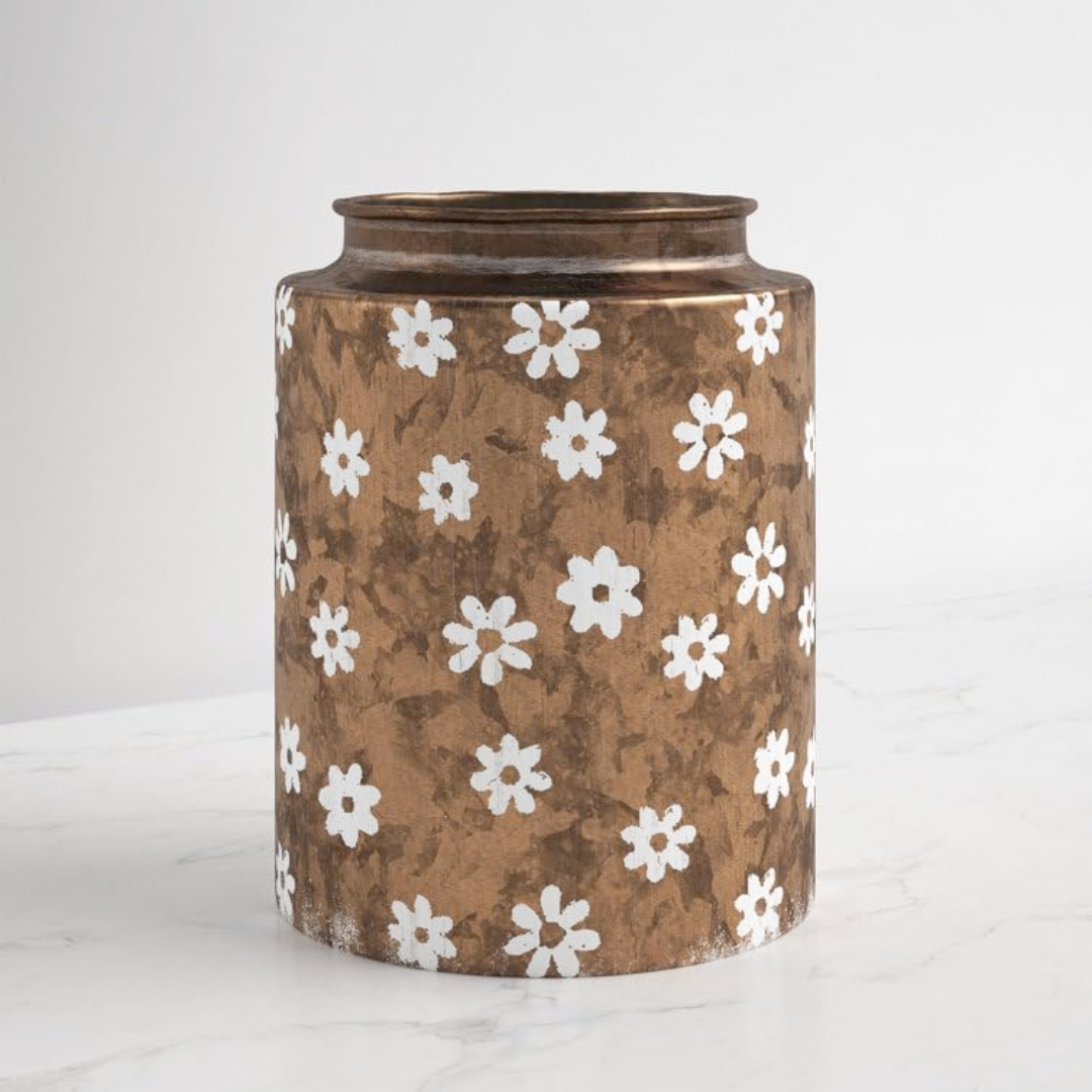 Decorative vase with white floral pattern on a brown background