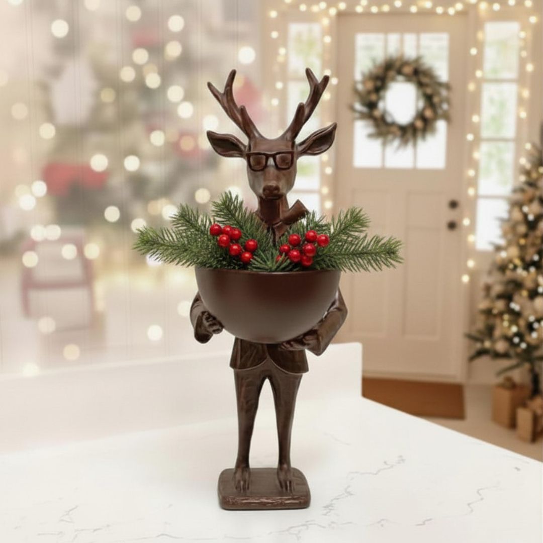 Decorative figure of a deer holding a bowl with greenery and red berries, set against a festive background.