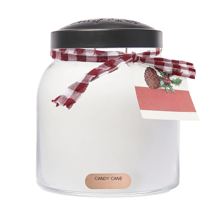 Glass jar candy cane scented candle with a black lid, red and white checkered ribbon, and a Christmas-themed tag on a white background.