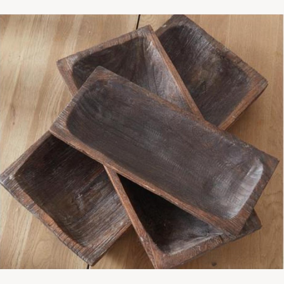 Wooden trays on a light wood surface