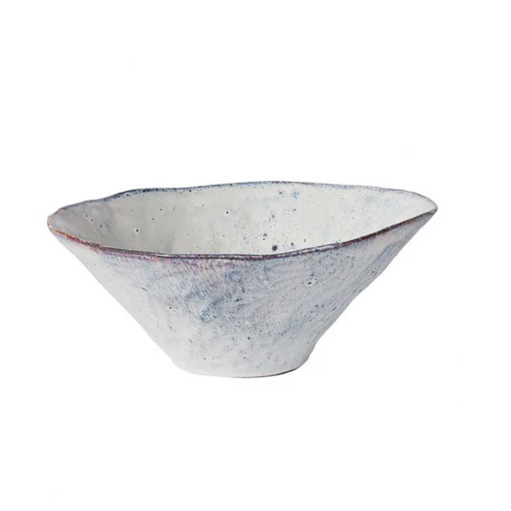 Ceramic bowl with speckled design on a white background