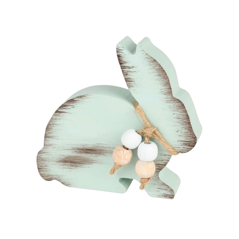 Decorative bunny-shaped item with beads on a white background