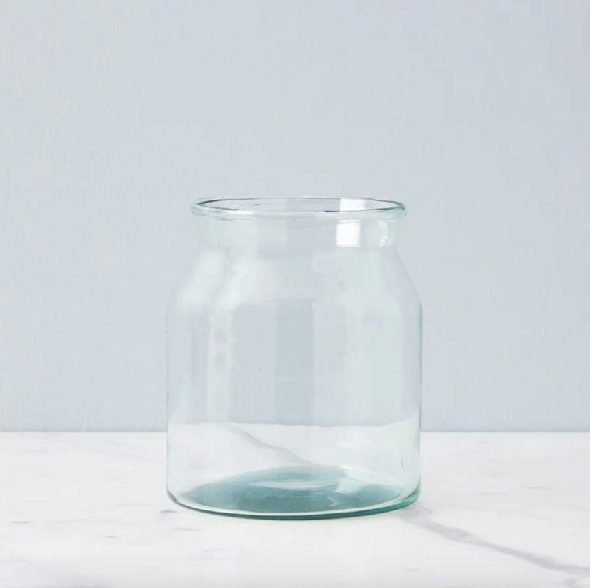 A clear glass mason jar with a wide mouth, made from recycled glass, displayed against a neutral background.