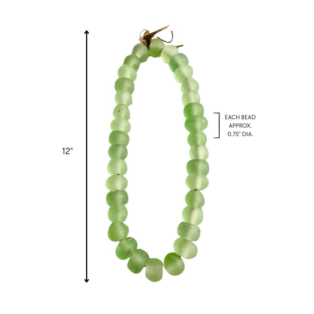 Green beaded garland with measurements on a white background