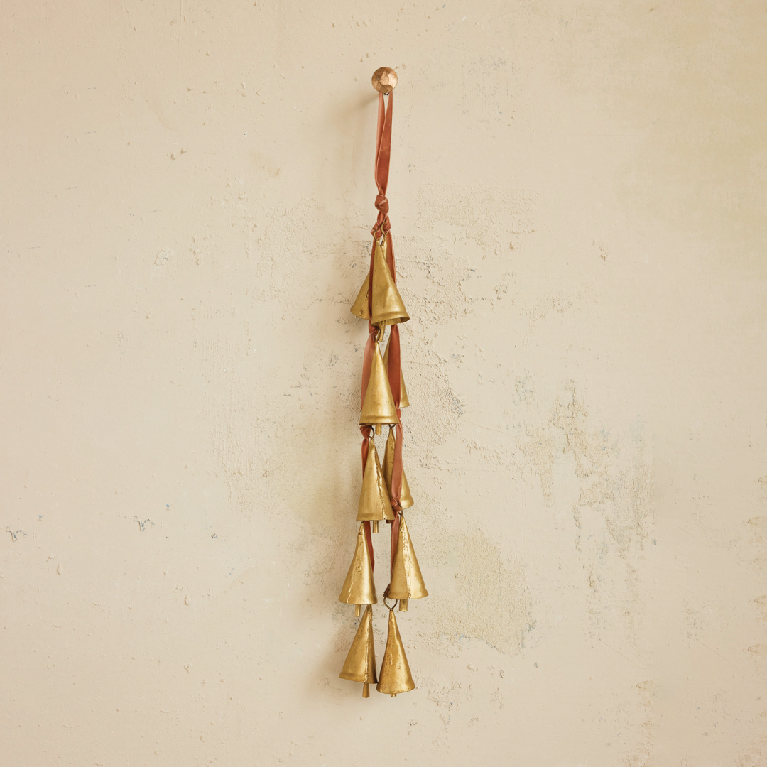 Brass bells hanging on a velvet hanger