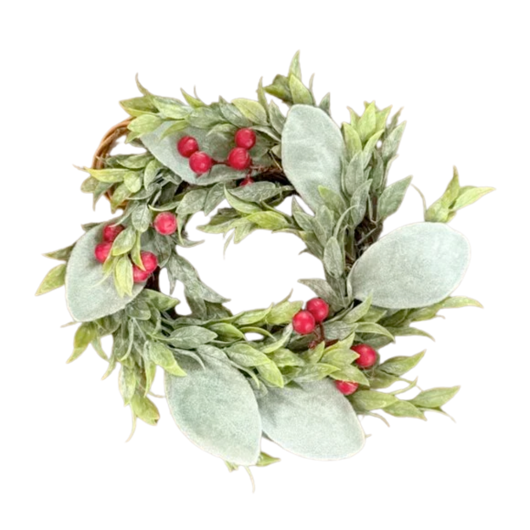 Decorative wreath with green leaves and red berries on a white background