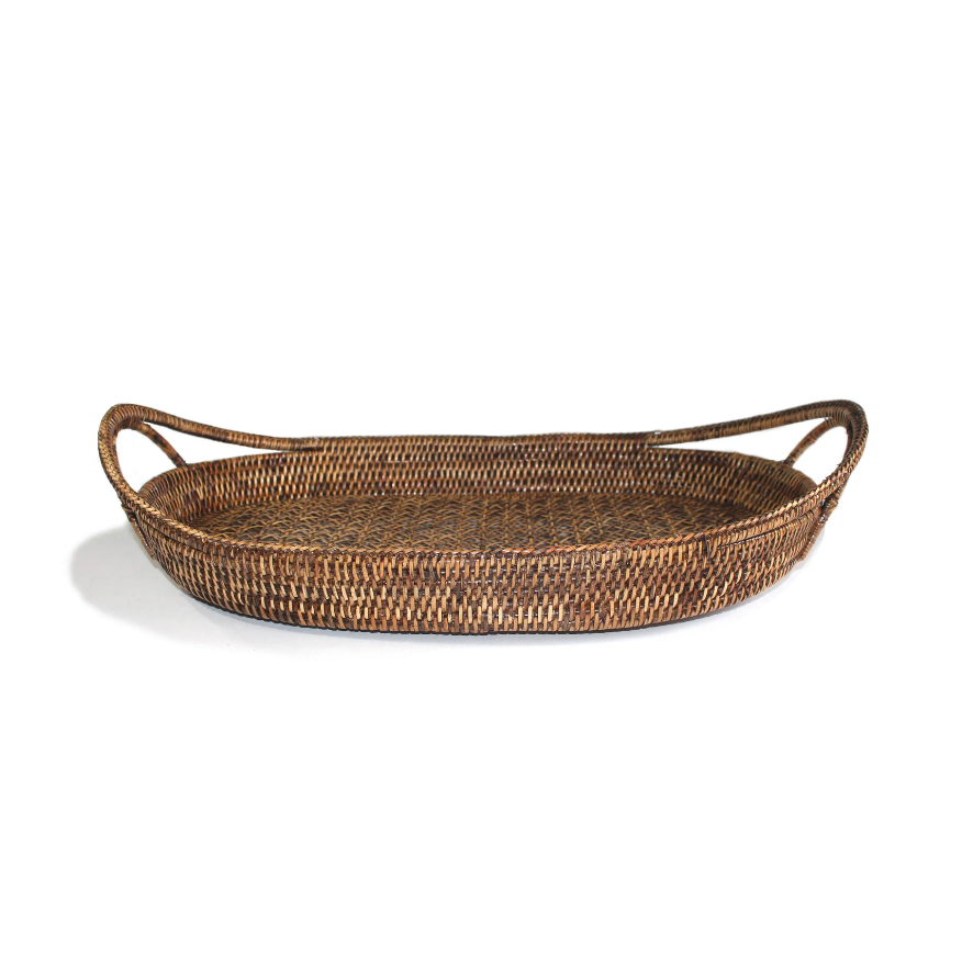 A natural brown woven rattan tray with two integrated side handles, shown on a clean white background.