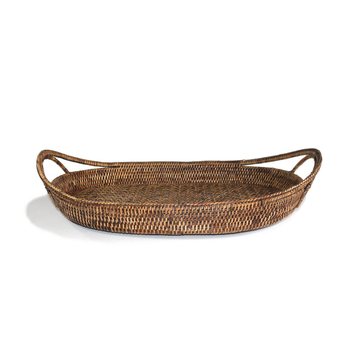 A natural brown woven rattan tray with two integrated side handles, shown on a clean white background.