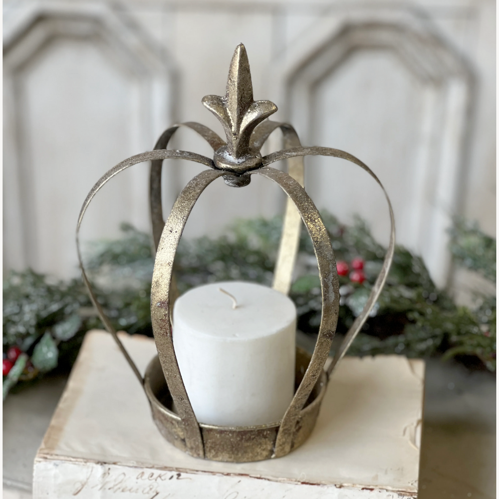 Decorative metal lantern with a candle on a wooden surface with a festive background.