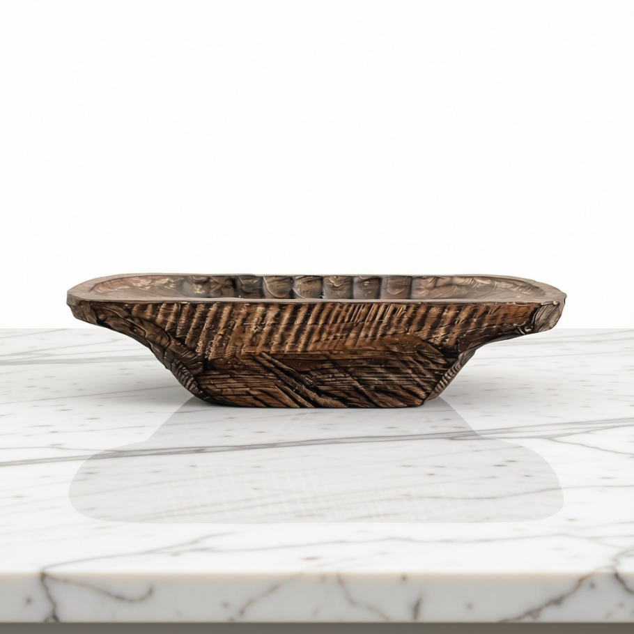 A rustic dark brown wooden dough bowl with a ribbed exterior and scalloped rim, displayed on a white marble surface against a white background.