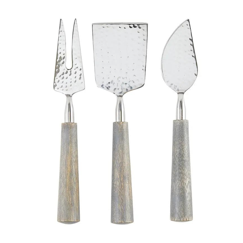 Three cheese knives with textured handles on a white background