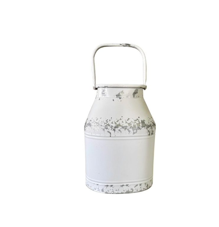A white distressed metal milk can with a top handle, shown against a plain white background.