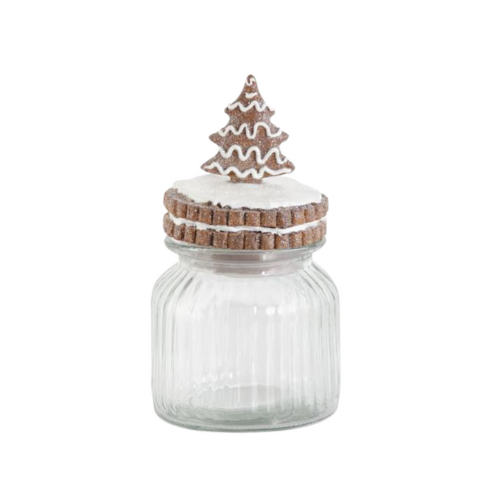 Clear glass jar with a decorative wooden lid shaped like a Christmas tree on a white background
