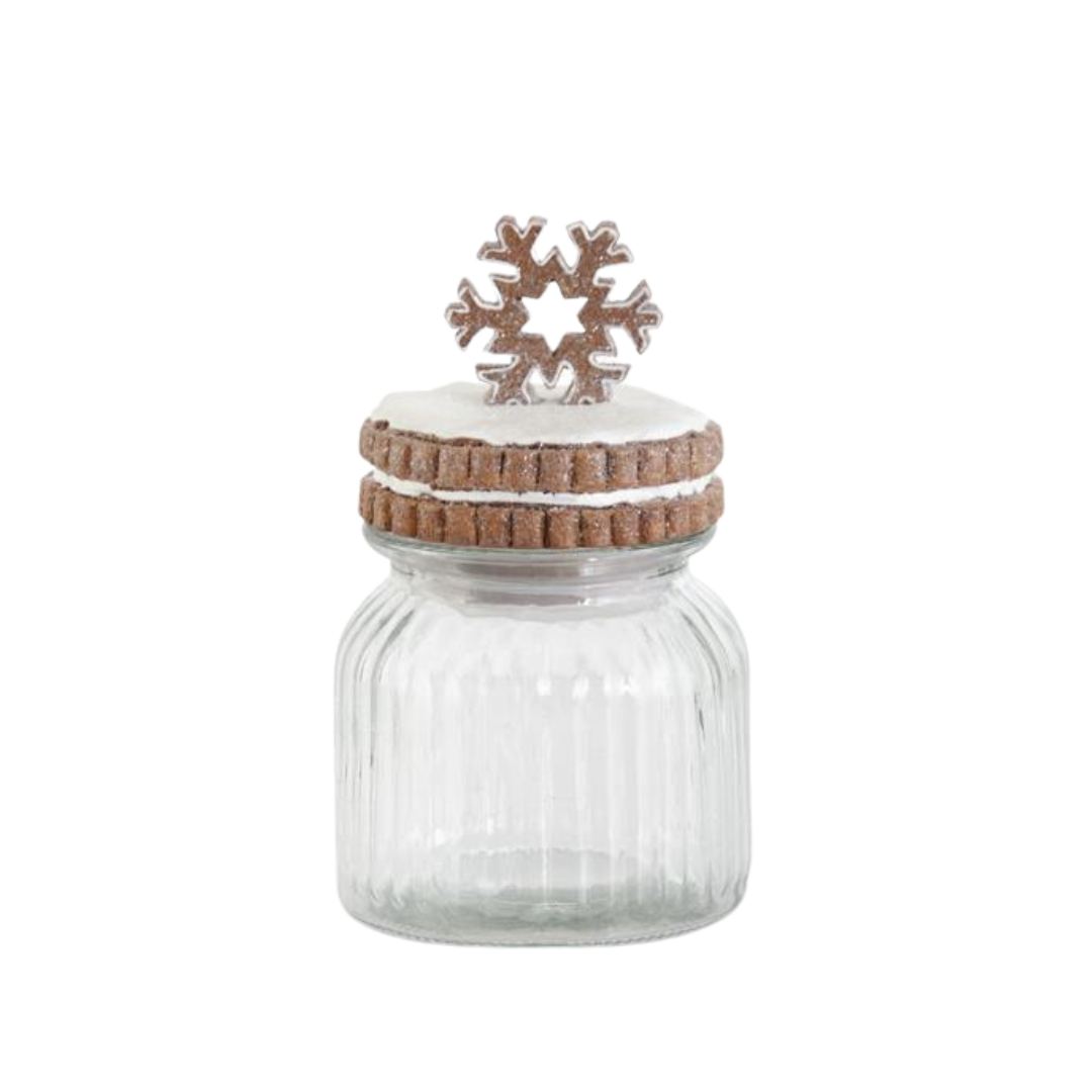 Clear glass jar with a wooden lid and snowflake decoration on a white background