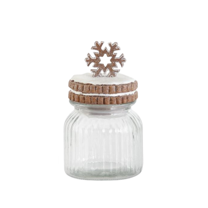 Clear glass jar with a wooden lid and snowflake decoration on a white background