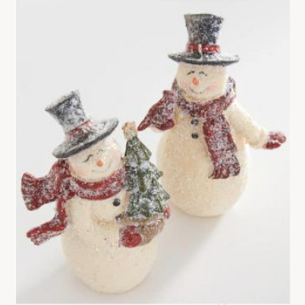 Two snowman figurines with scarves and hats on a white background