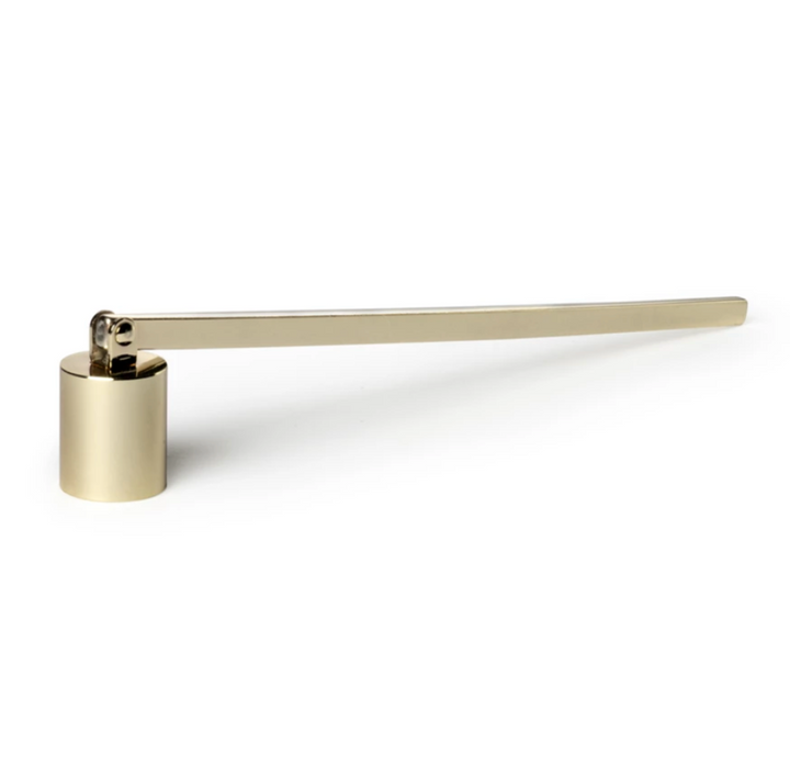 Gold-colored candle snuffer with a long handle on a white background