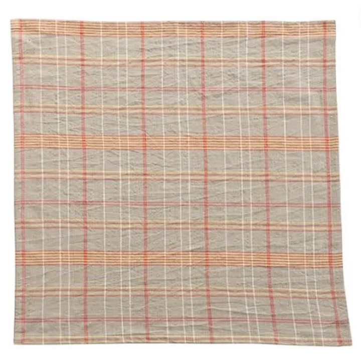 Plaid patterned napkin in gray and orange colors on a white background