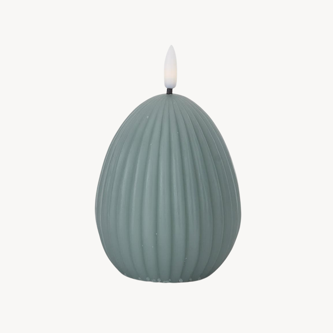 A green egg-shaped LED candle with a accordion design and a flickering glow.