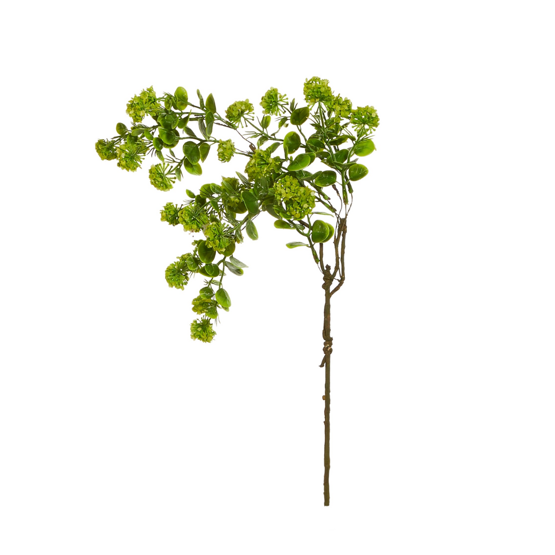 Artificial green leaf branch on a white background