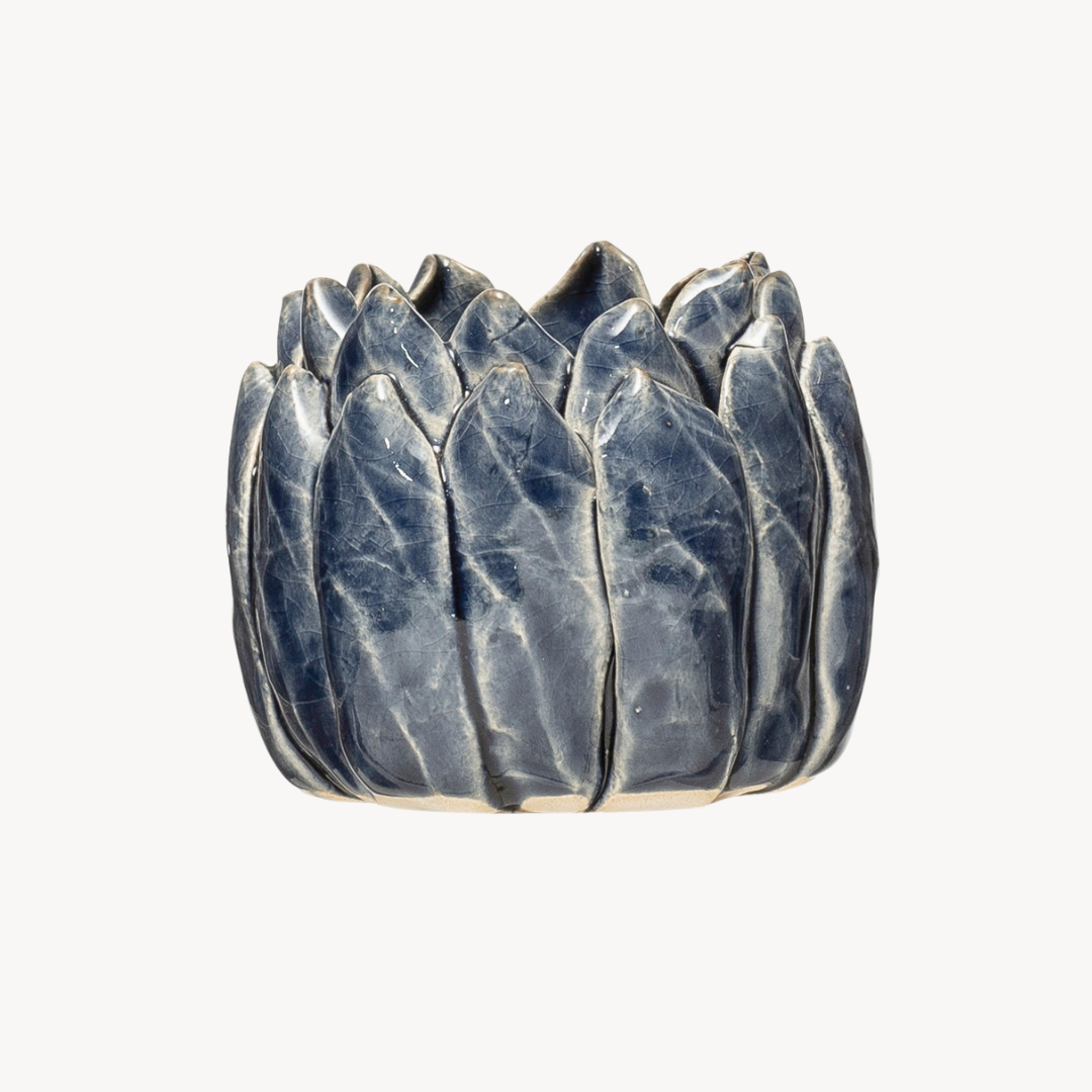 Stoneware artichoke-shaped tealight holder on a white background