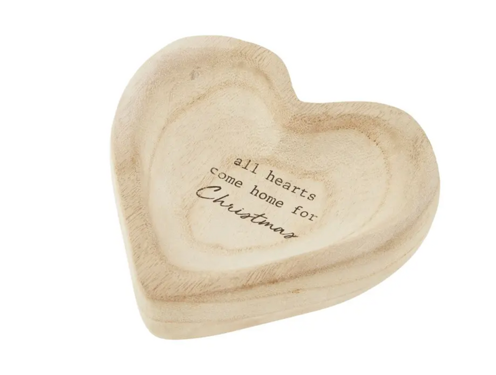 Heart shaped mango wood dish with text that says all hearts come home for Christmas