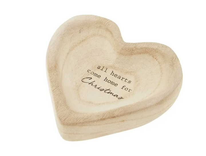 Heart shaped mango wood dish with text that says all hearts come home for Christmas