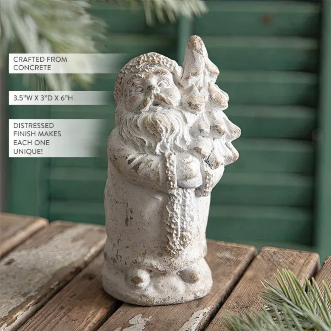 Concrete Santa Claus figurine on a wooden surface with text about its material and dimensions.