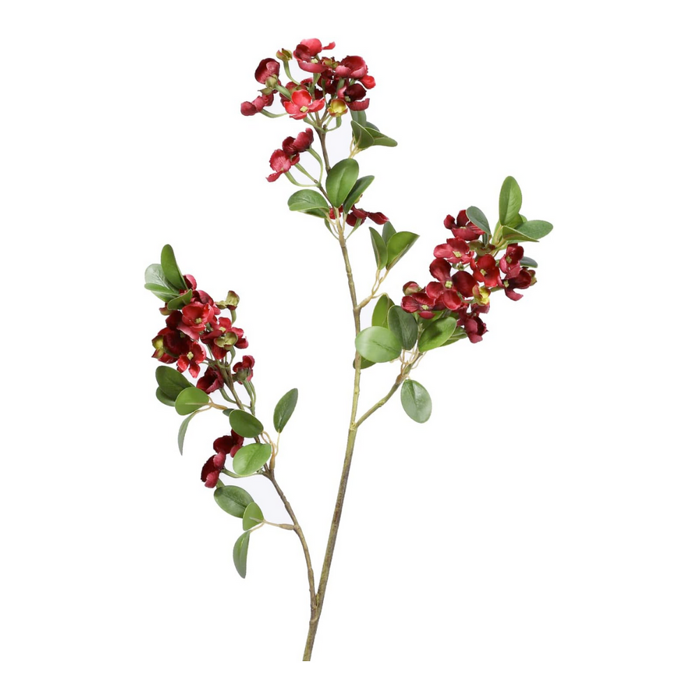 Artificial flower branch with red flowers and green leaves on a white background