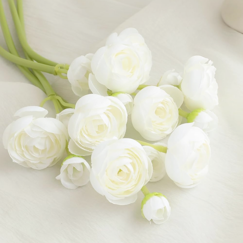 White artificial ranunculus flower bouquet on a light background