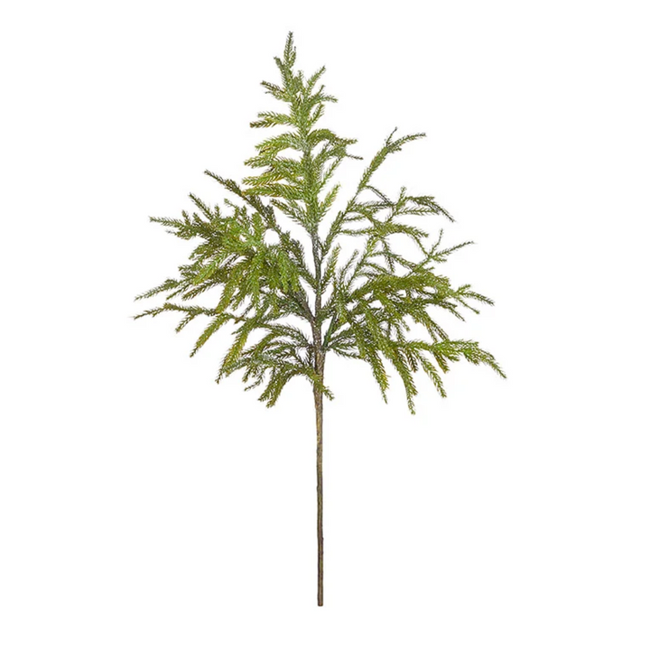Artificial green tree branch on a white background