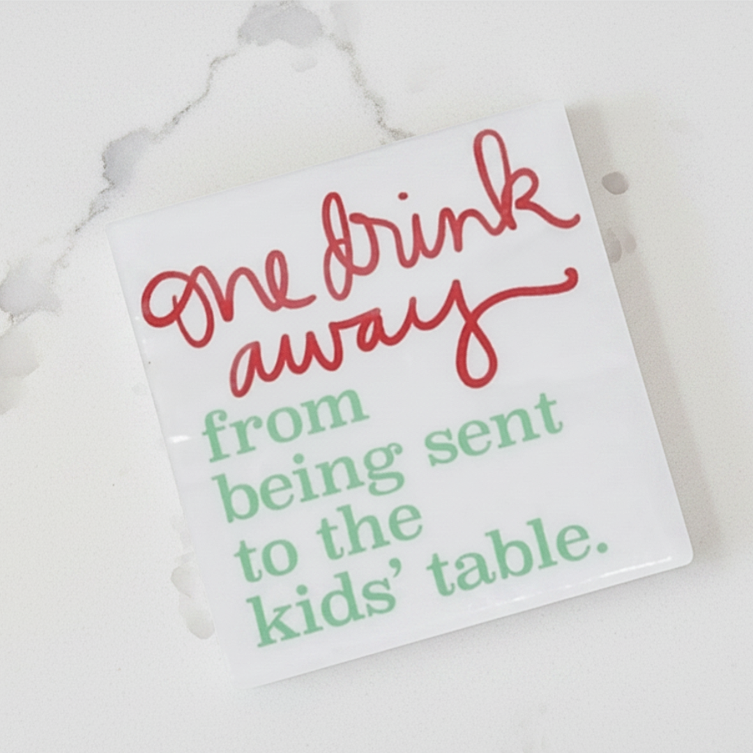 White paper with red and green text on a marble surface