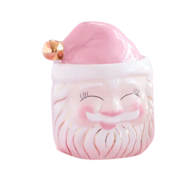 A pink ceramic candy jar with a Santa Claus design, featuring hand-glazing and gold accents.
