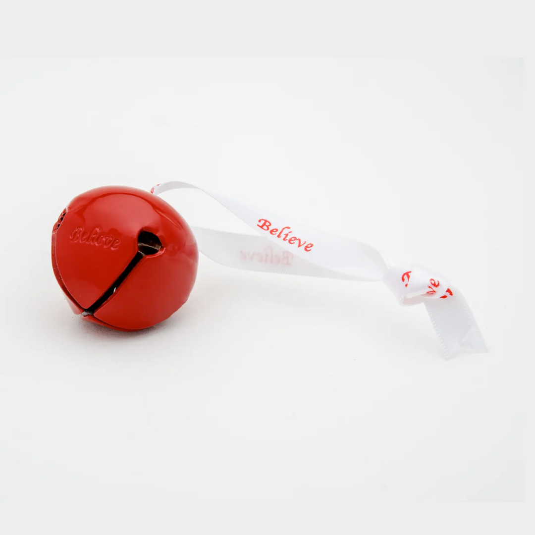 Red bell with a white ribbon that says 'Believe' on a white background