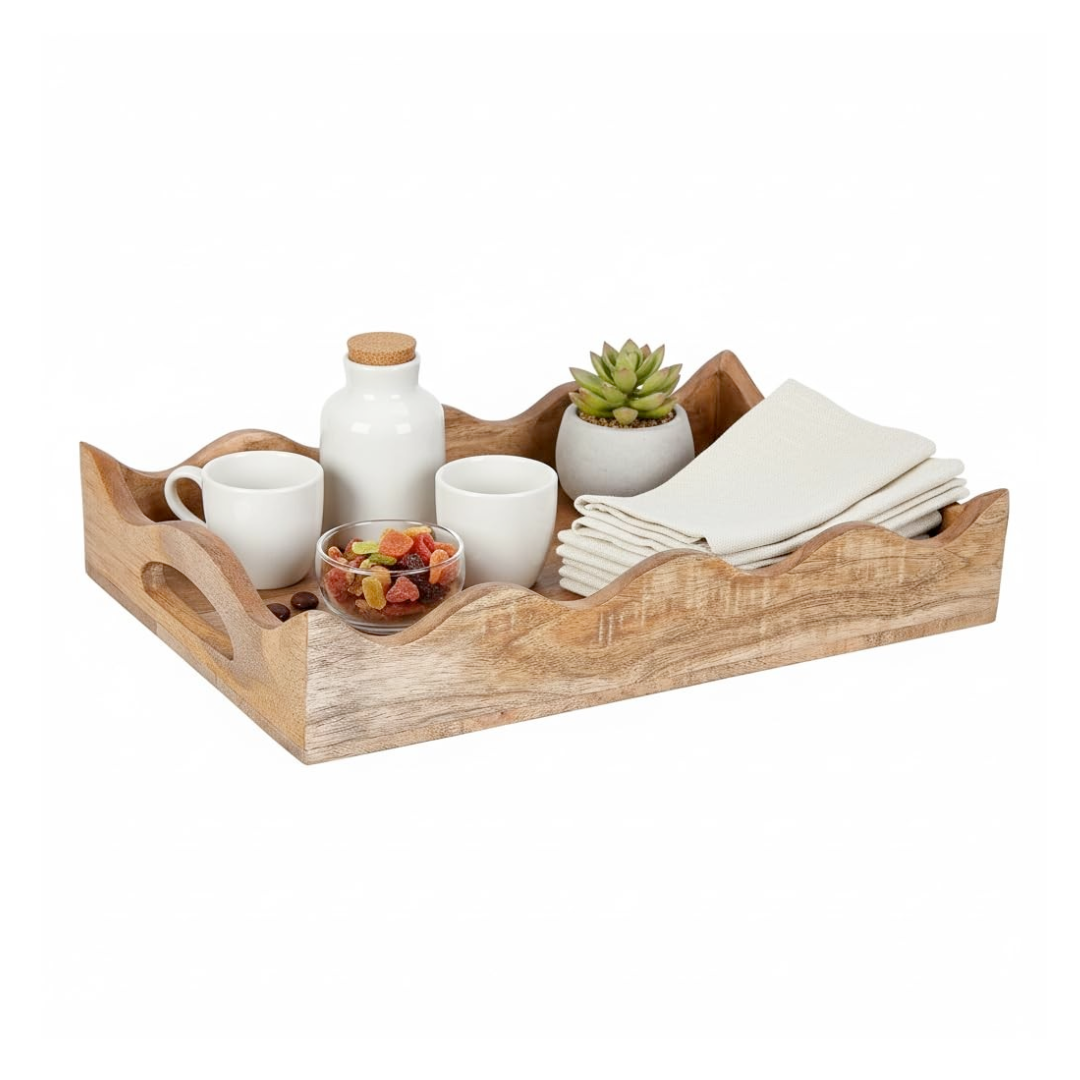 Scallop edge Wooden tray with ceramic items including cups, a bottle, a bowl of snacks, and a small plant on a white background.