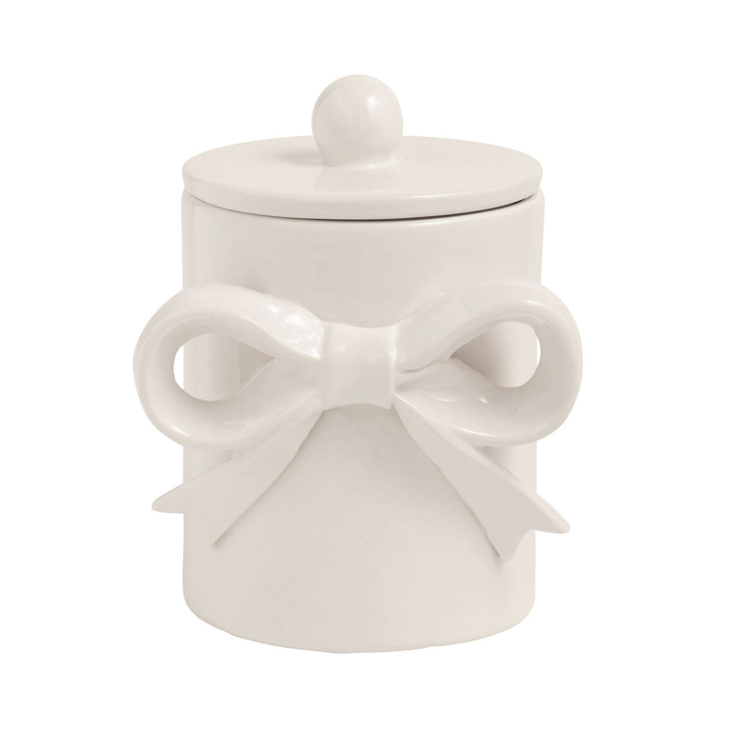 White ceramic jar with a decorative bow design on a white background