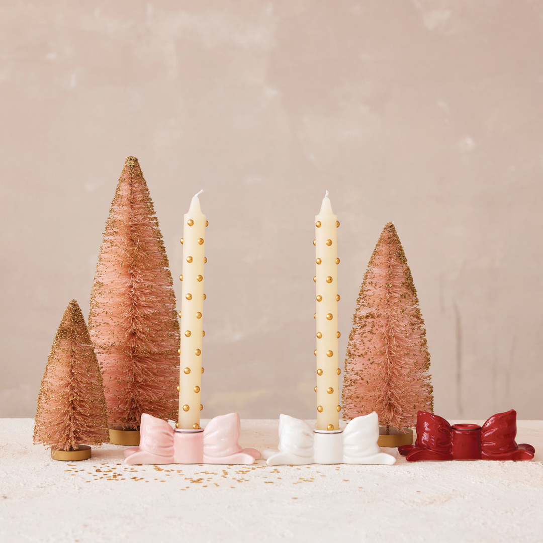 Decorative Set of 2 Gold Dot Taper Candles with cone-shaped trees on a neutral background