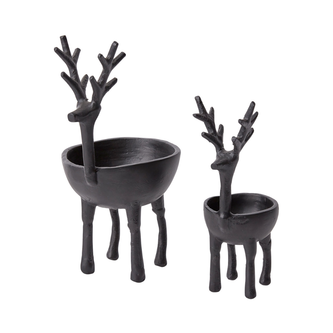 Two black deer-shaped bowls on a white background