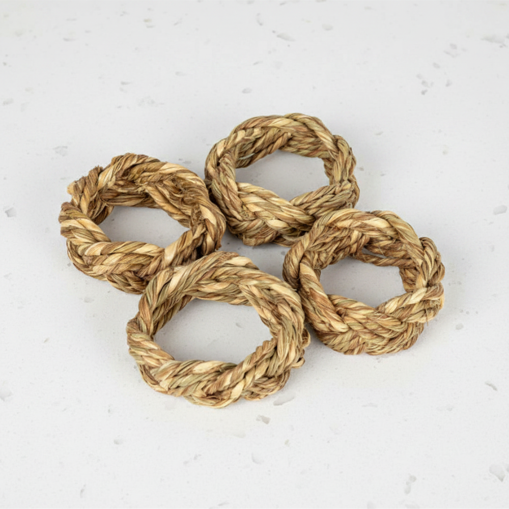 Four braided rope coasters on a light gray surface