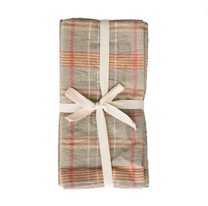 gray and orange Plaid pattern napkins with a white ribbon on a white background