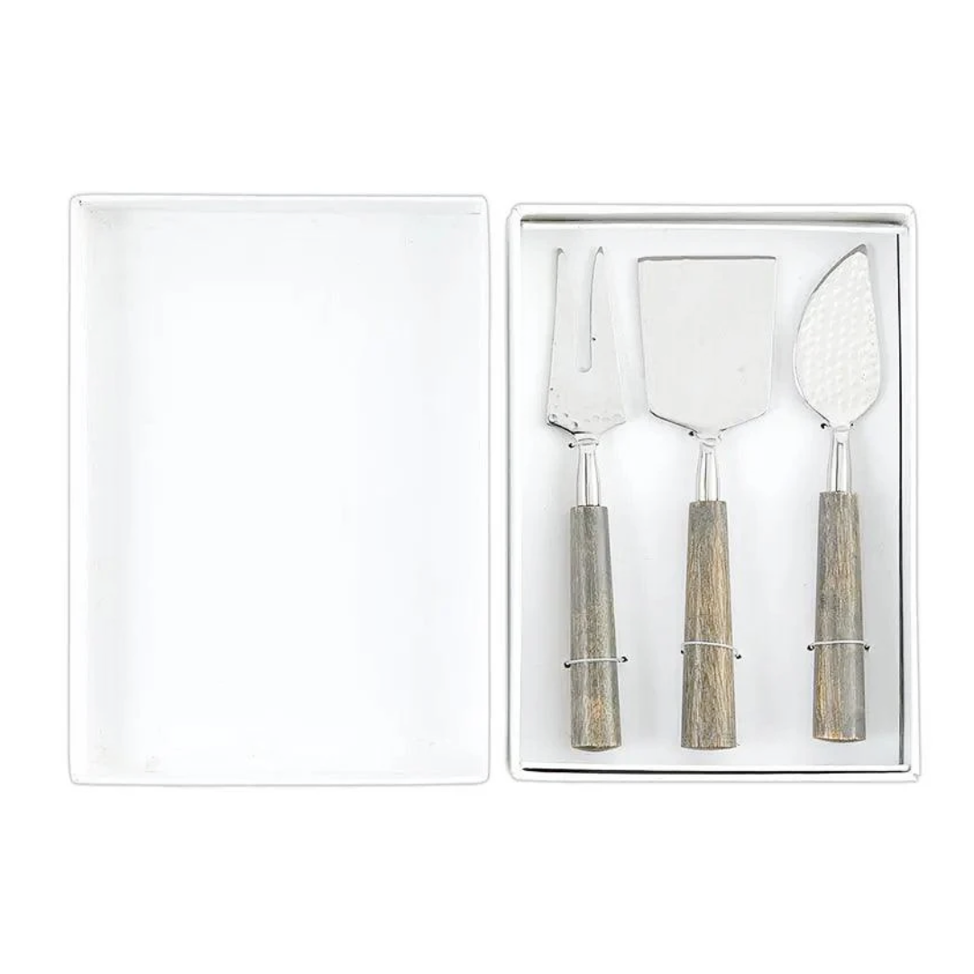 Set of three cheese tools with wooden handles in a clear box on a white background