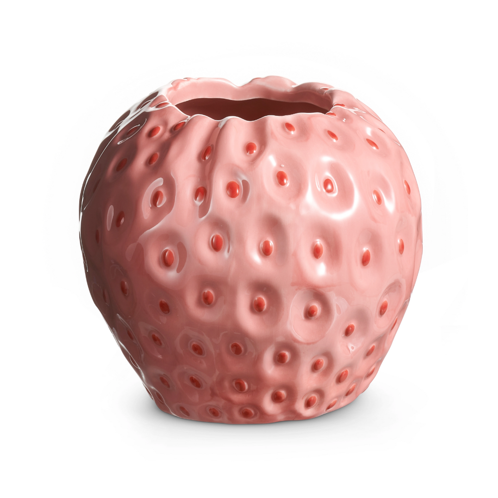 Pink strawberry-shaped ceramic vase on a white background