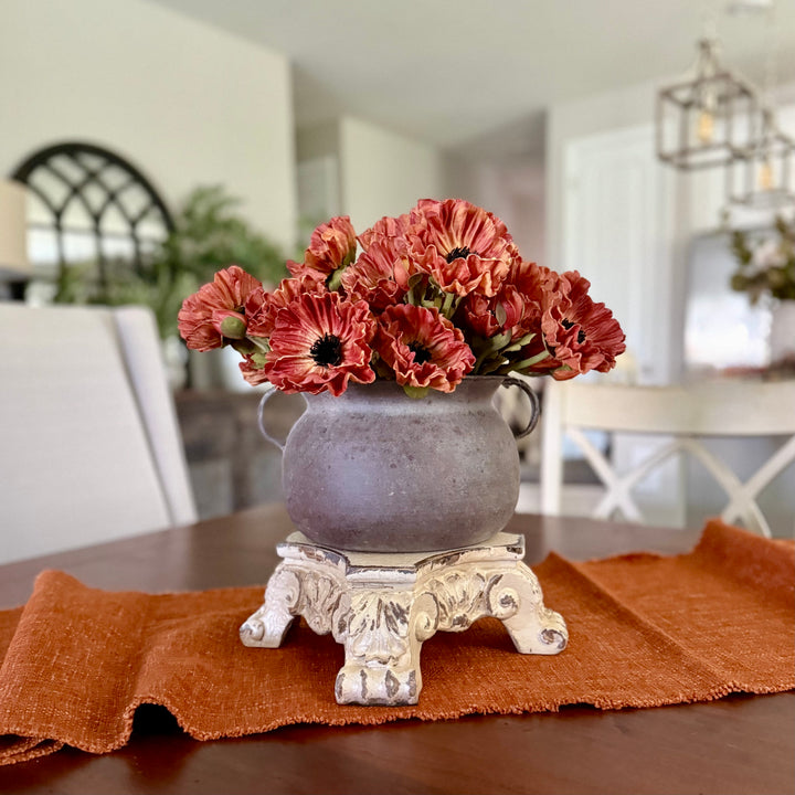 Iron pot with Sunset Real Touch Poppy Bundles on a table in a home setting