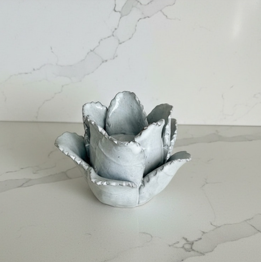 Terracotta Flower-Shaped Tea Light Holder on a marble surface