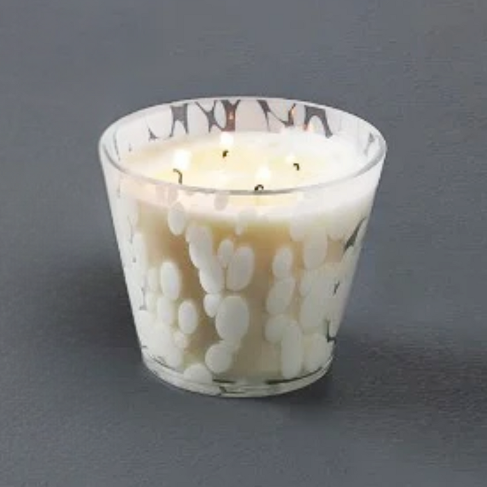 Vanilla Candle in a glass holder with a floral design on a gray background