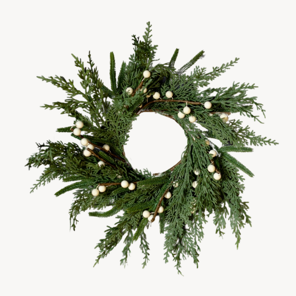Green wreath with white berries on a white background