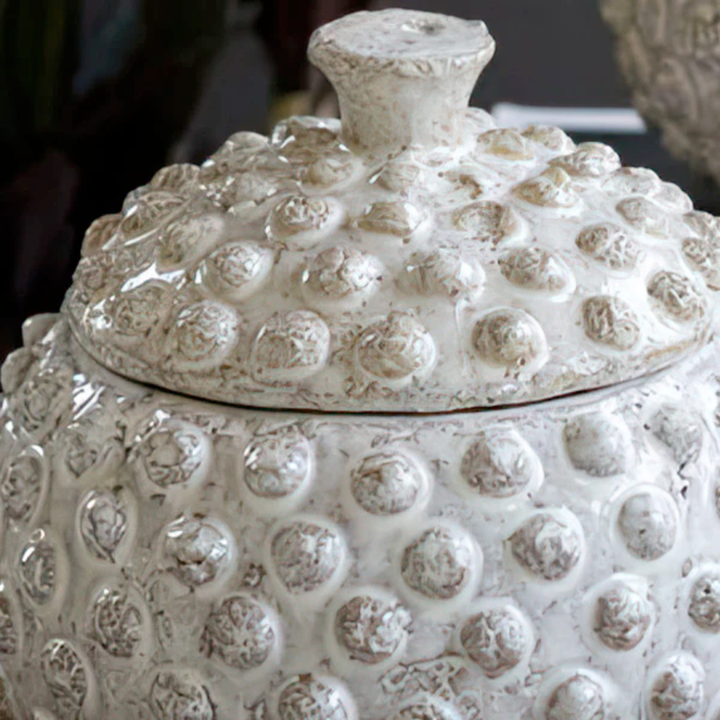 White textured ceramic jar with lid