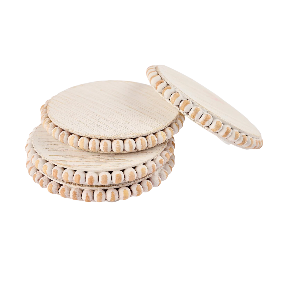 Two sets of beaded wood coasters in gray and white, tied with twine and stacked.
